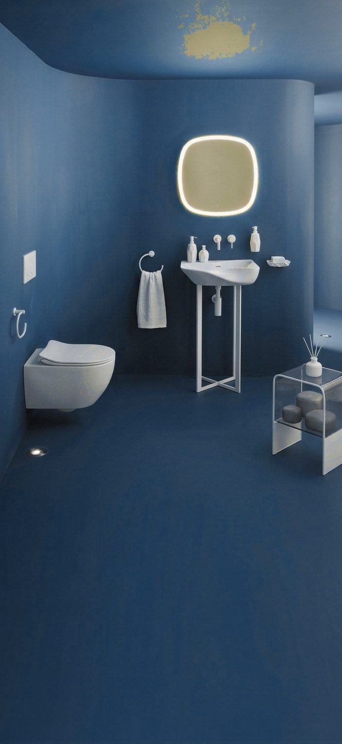 Brushed gold tapware and stone basin in a Dubai villa bathroom